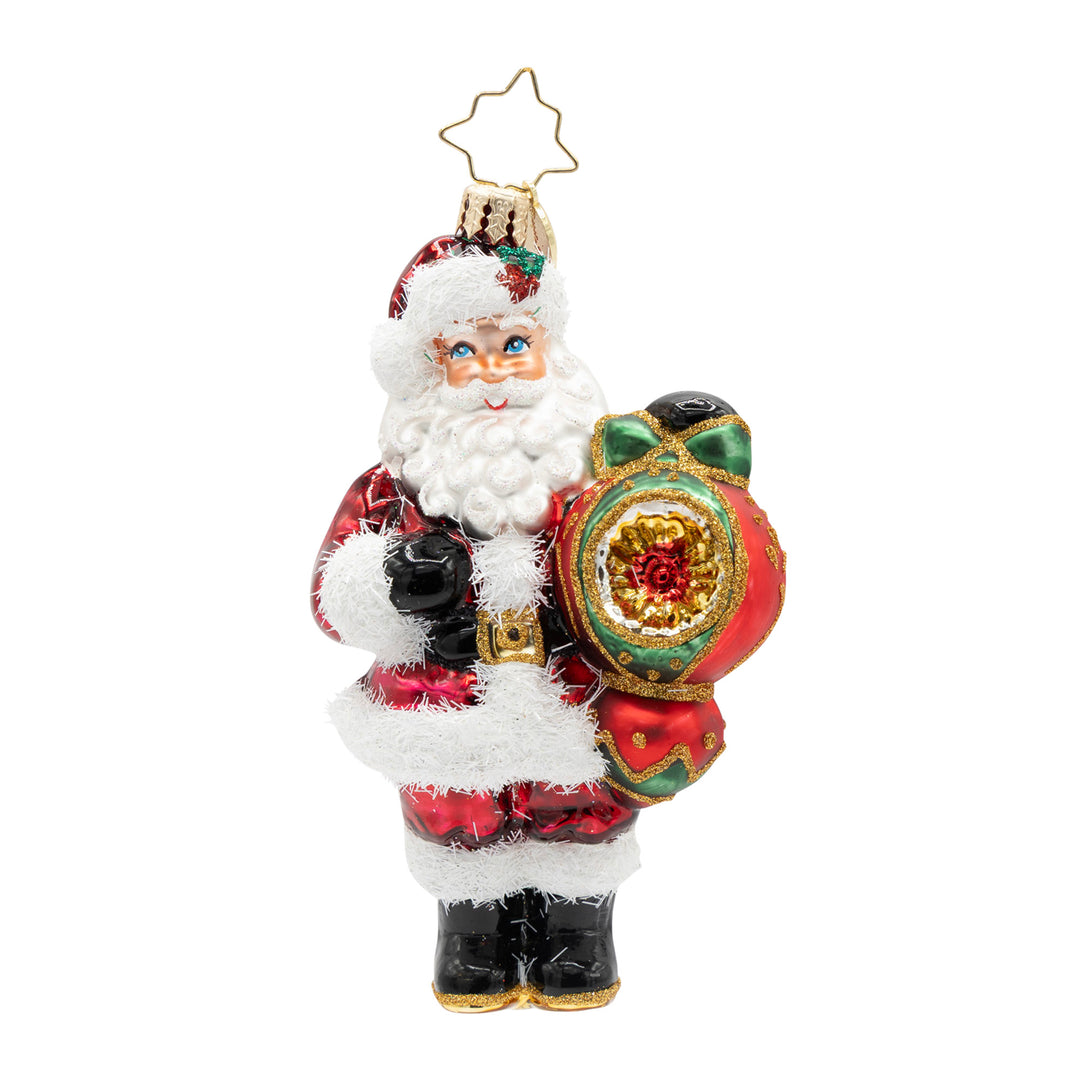 The Merry Bauble Santa glass ornament featuring Santa holding a large red and green bauble.