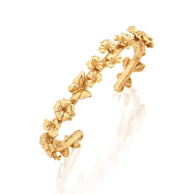 Gold Petite Cuff bracelet featuring a delicate meadow walk flower motif with an open silhouette.