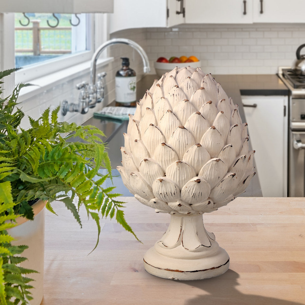Resin pedestal shaped like a weathered artichoke with textured surface