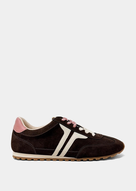 Sarah low-top sneaker in dark brown suede with white side stripes and a pink heel accent.