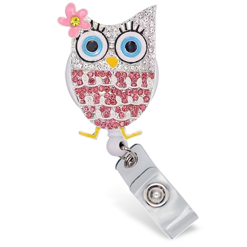 Heavy-duty rotating alligator clip badge reel featuring a hand-painted enamel background with sparkling rhinestone accents.