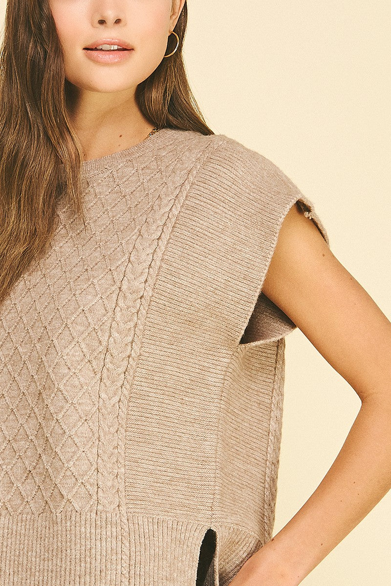 Lyndsey diamond cable knit sweater in soft gray with a relaxed fit silhouette.