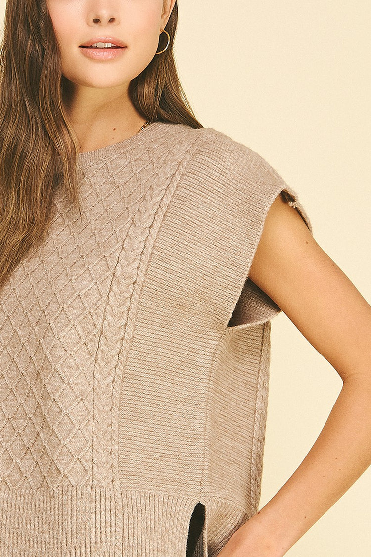 Lyndsey diamond cable knit sweater in soft gray with a relaxed fit silhouette.