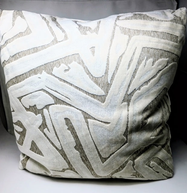 A 24x24 hand-crafted pillow with a textured geometric pattern in white and grey.