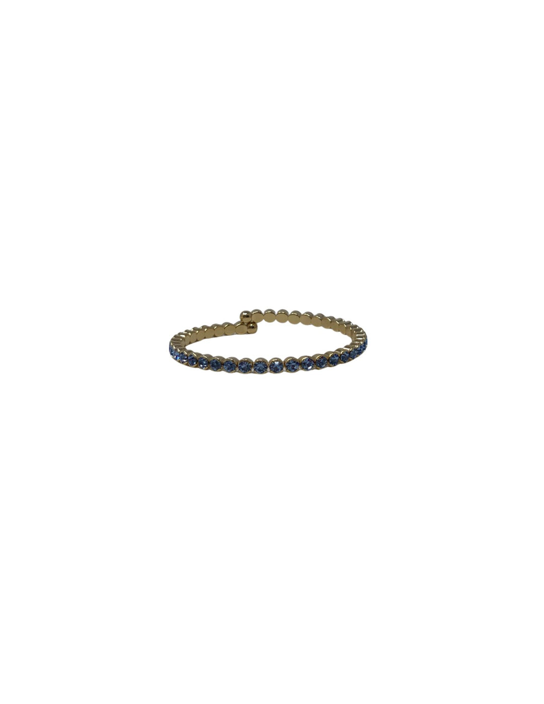 Gold cuff bracelet featuring a row of small, round blue crystals.