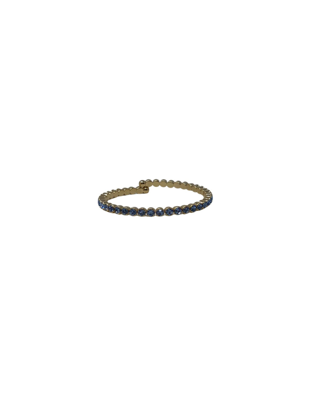 Gold cuff bracelet featuring a row of small, round blue crystals.
