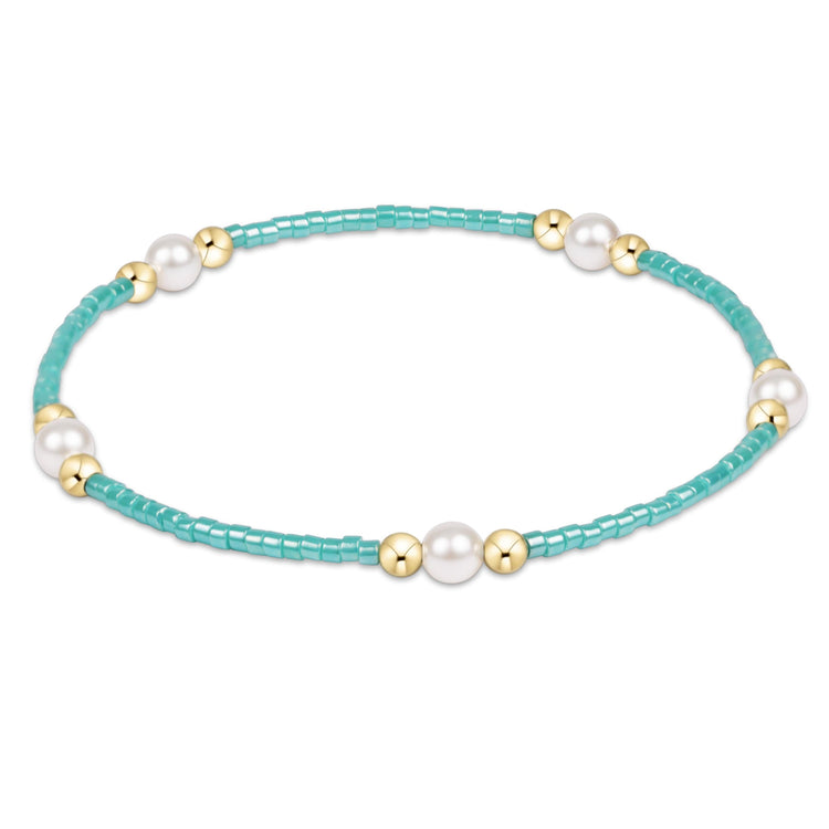 Hope Purpose Pearl Bracelet with turquoise seed beads, gold-filled beads, and white pearls.