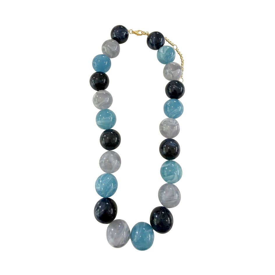 Ava Chunky Beaded Necklace with blue, grey, and navy marbled resin beads and gold-plated clasp.