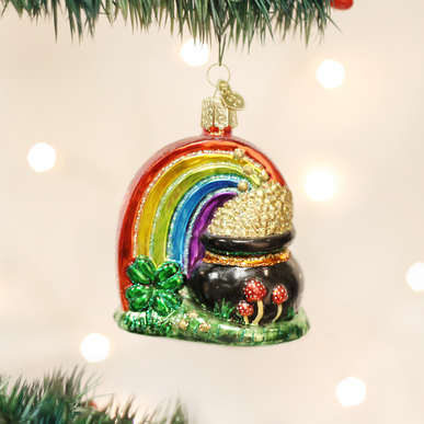 Glass Pot of Gold ornament with a rainbow, four-leaf clover, and mushrooms on a Christmas tree.