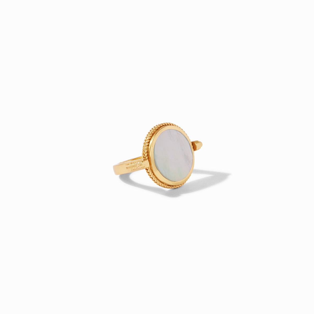 Gold revolving ring featuring an oval mother of pearl stone with a twisted rope border.