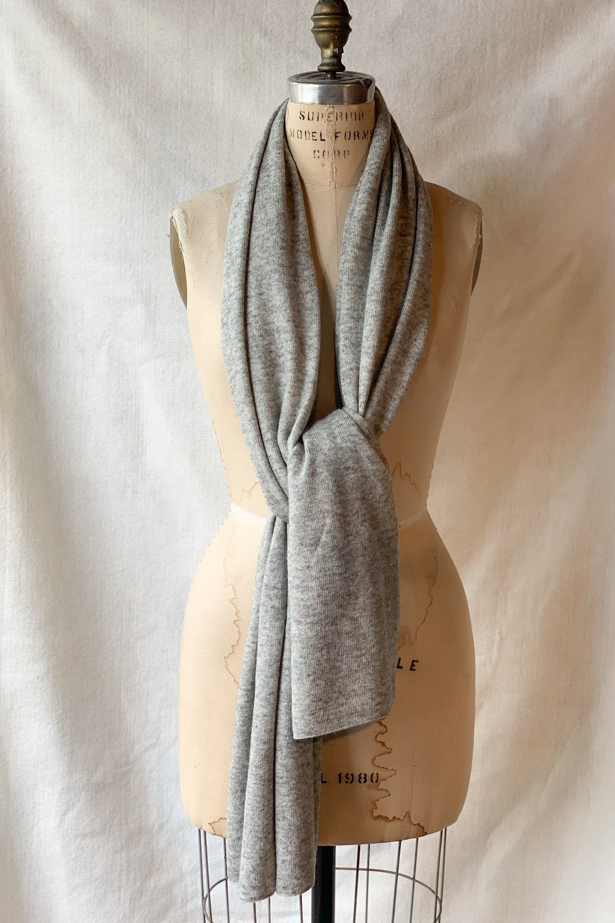 Solid cashmere scarf in a neutral tone with a soft drape.