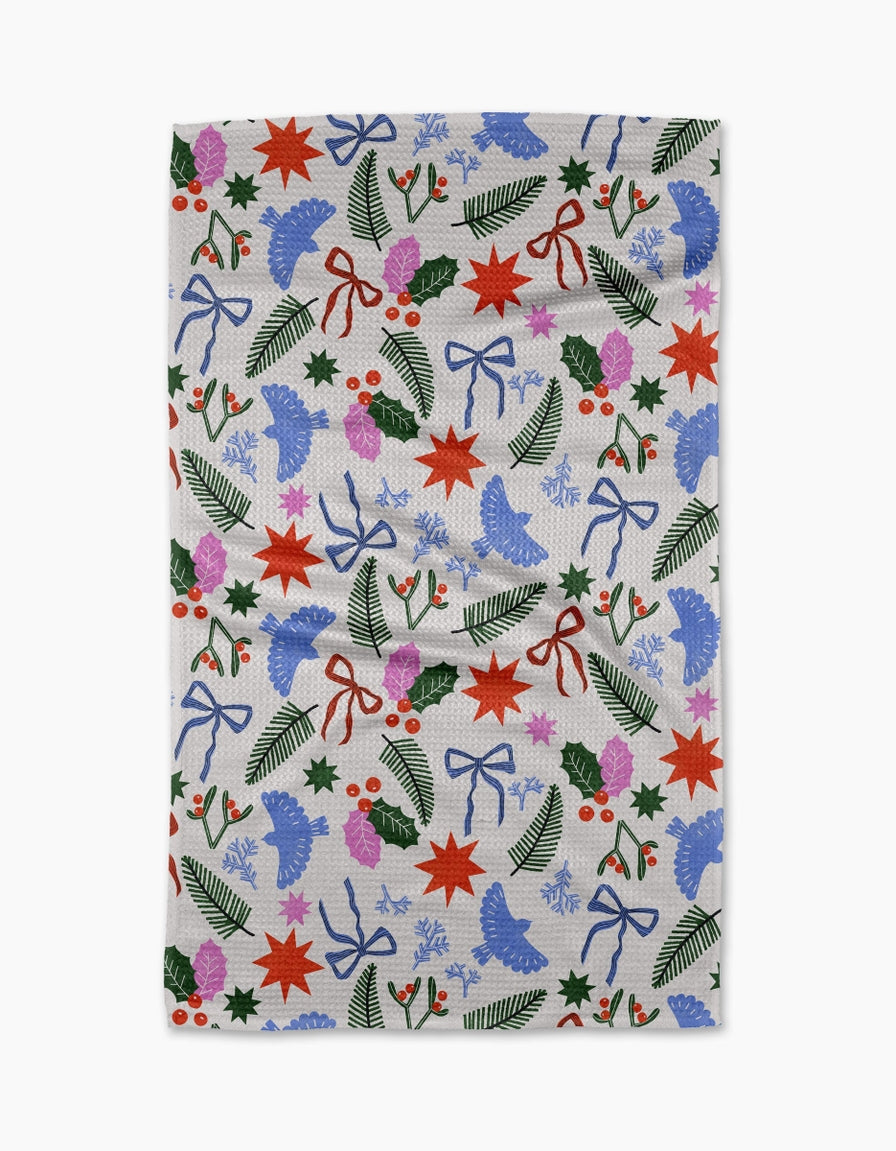 Holiday tea towel with waffle weave construction in red featuring a festive snowman pattern.