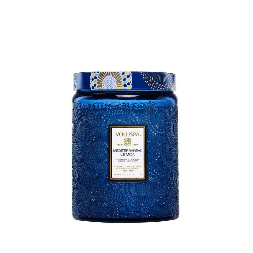 Voluspa Mediterranean Lemon 18oz Large Jar Candle in a blue embossed glass jar with a patterned lid.