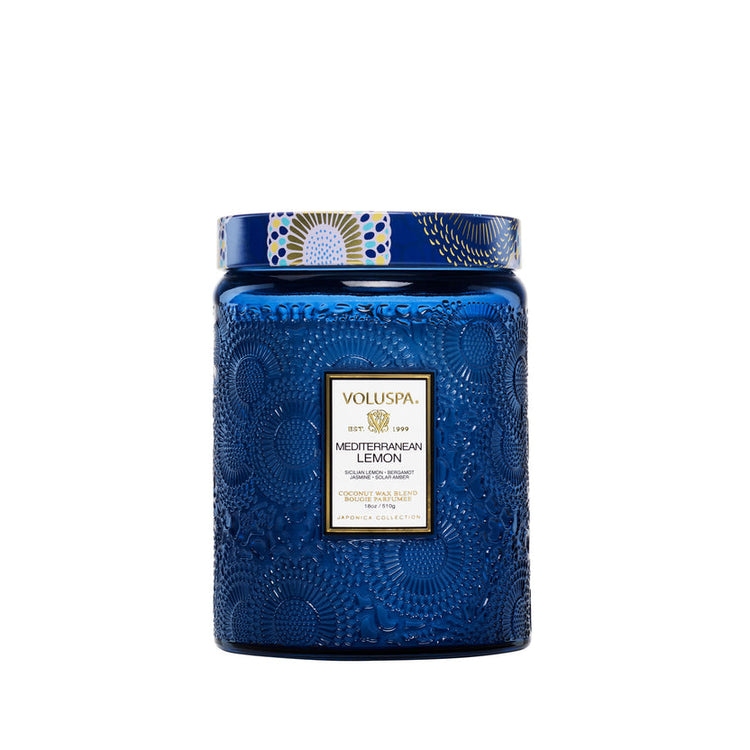 Voluspa Mediterranean Lemon 18oz Large Jar Candle in a blue embossed glass jar with a patterned lid.