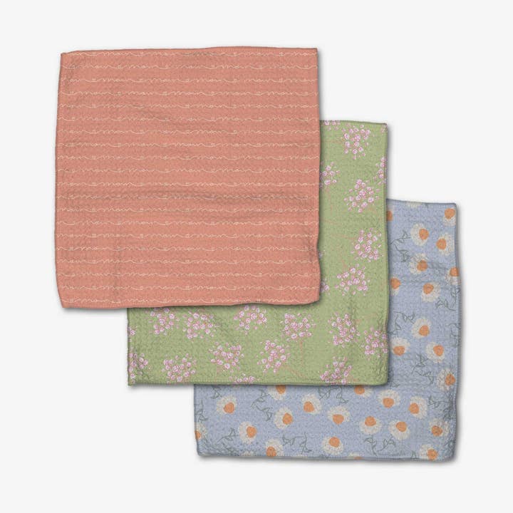 Set of three waffle weave dishcloths in recycled polyester with single-sided prints and hang loops.