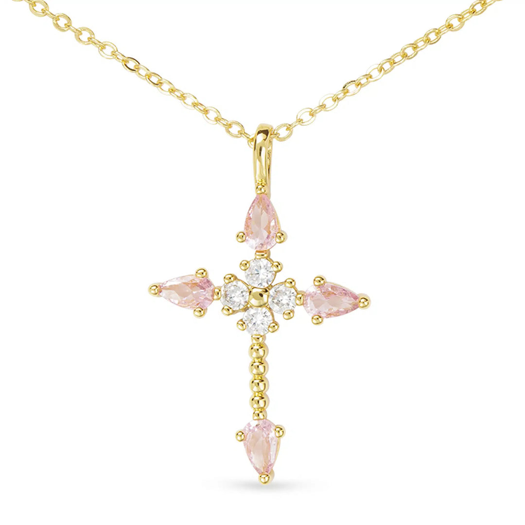 Gold cross necklace featuring pink pear-shaped CZ stones and clear round accents on a gold chain.