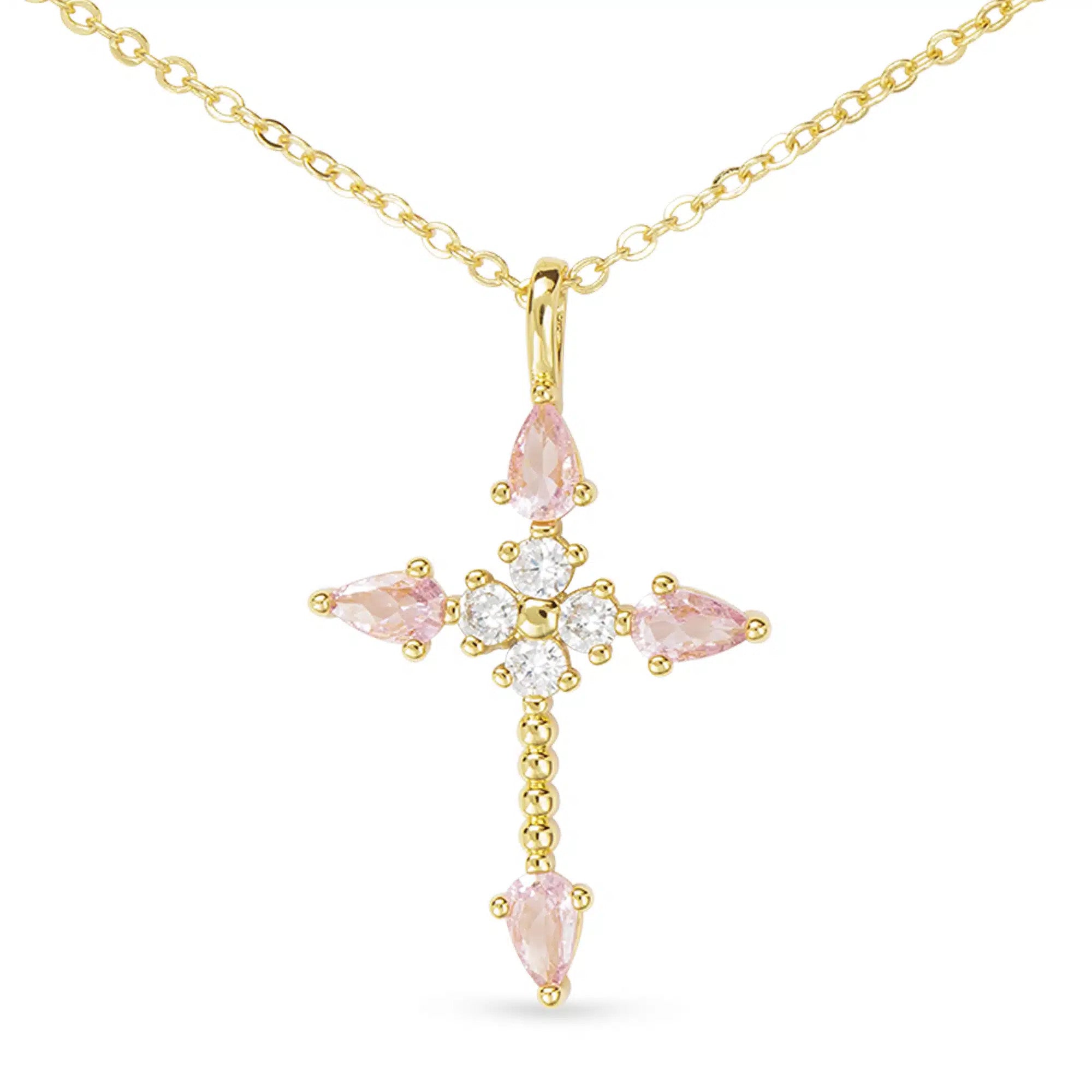 Gold cross necklace featuring pink pear-shaped CZ stones and clear round accents on a gold chain.