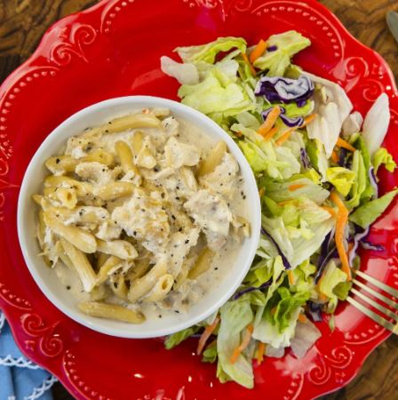 Tuscan Chicken Pasta meal kit with chicken, sun-dried tomatoes, cream cheese, and pasta.