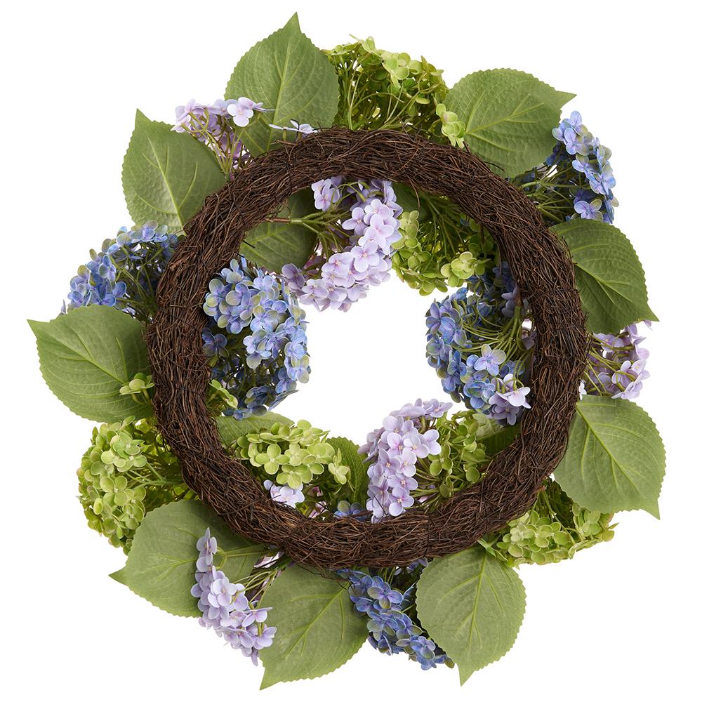 Round artificial hydrangea wreath with mixed green foliage on a rattan base.