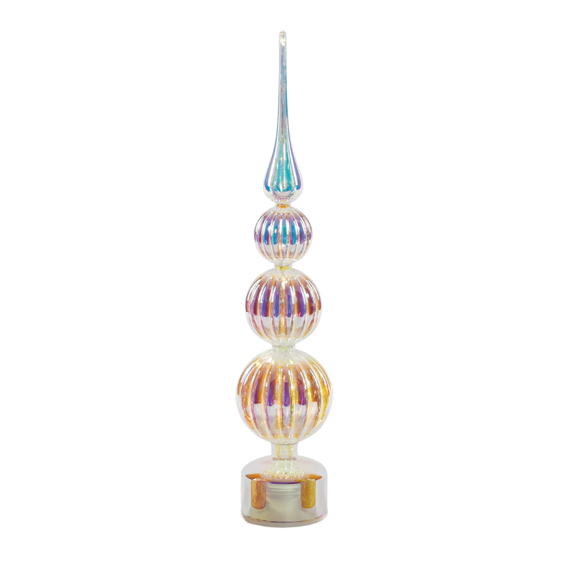 Revolving lit glass tree with iridescent ribbed spheres and a tall pointed spire on a clear base.