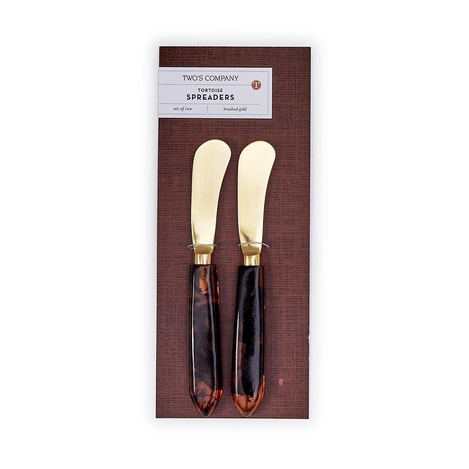 Set of two tortoise swirl resin handle spreaders with brushed gold stainless steel blades.