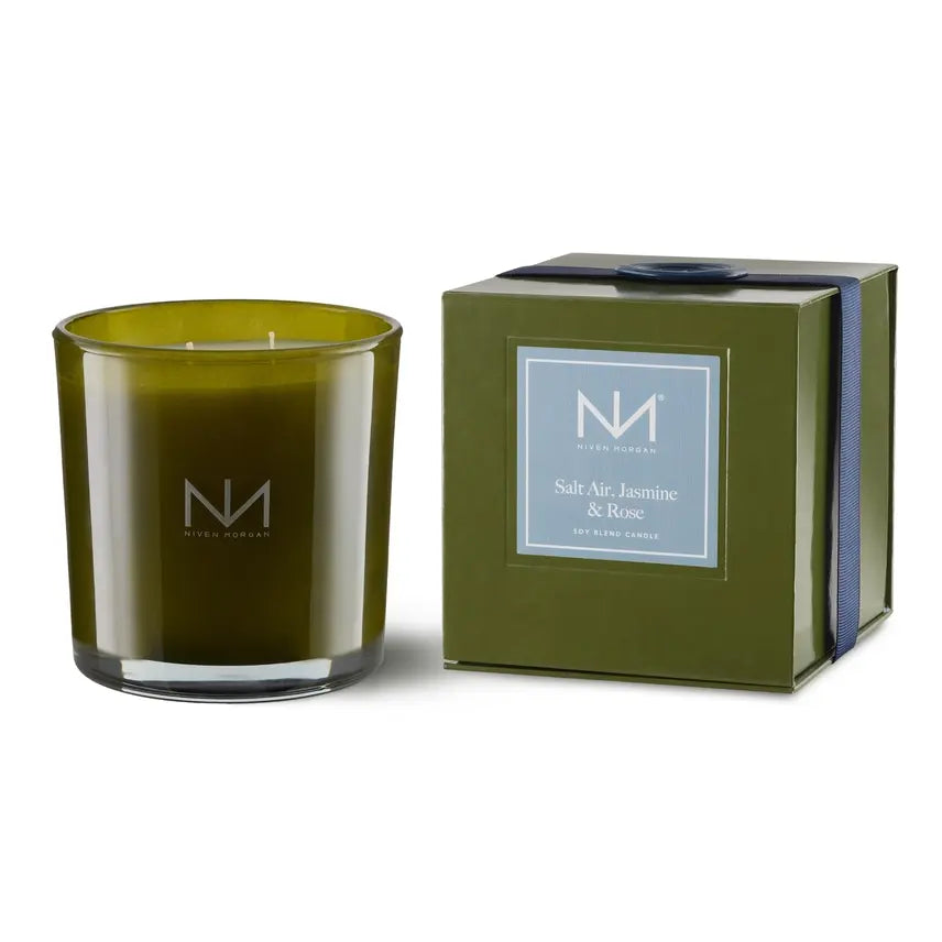 Dark olive glass jar containing a double-wick soy blend candle with an even burn.