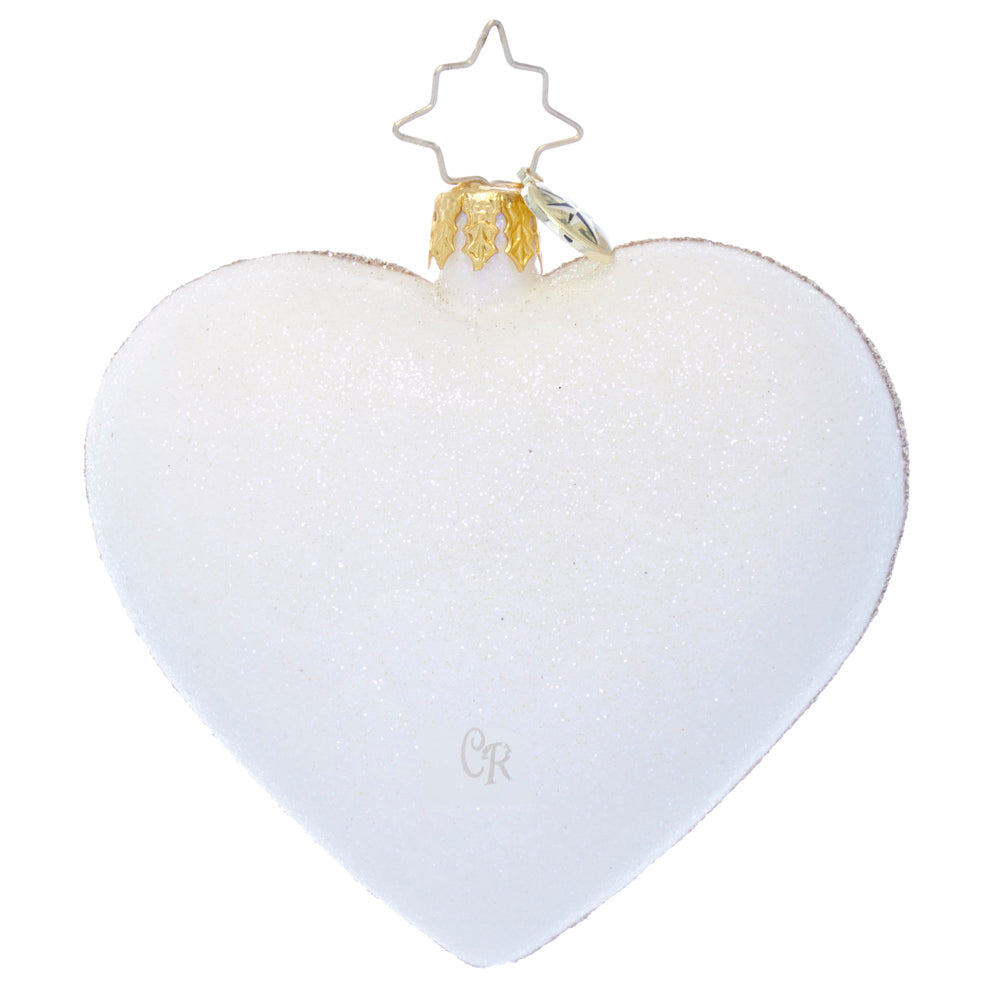 White glitter heart-shaped glass Christmas ornament with a gold cap and star-shaped wire hanger.