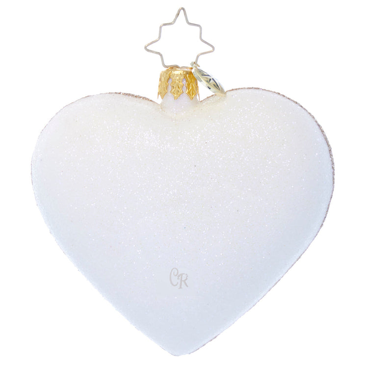 White glitter heart-shaped glass Christmas ornament with a gold cap and star-shaped wire hanger.