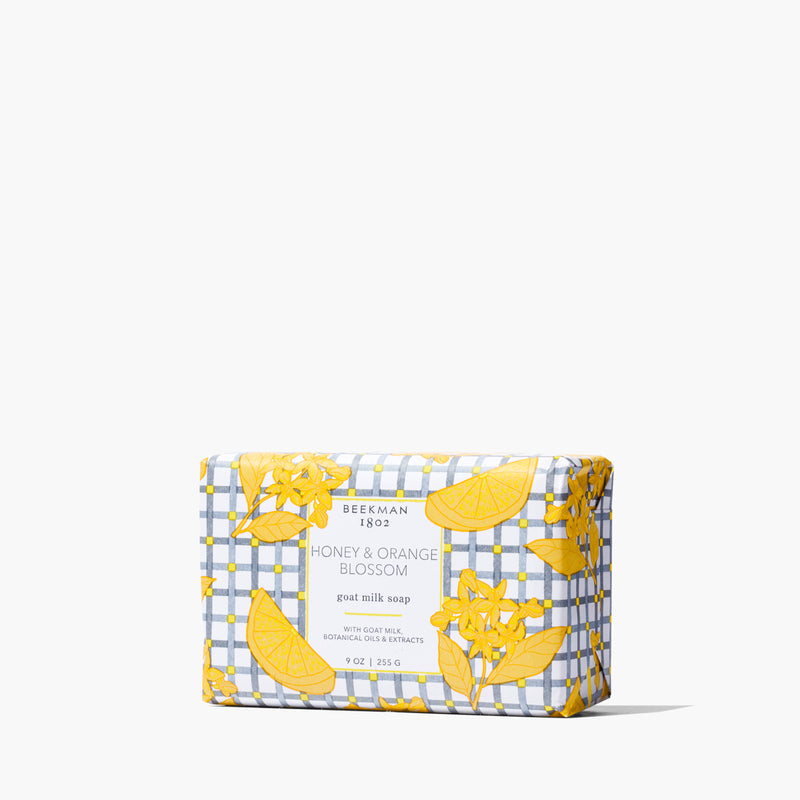 Triple-milled bar soap with a creamy off-white color featuring embedded speckles from nourishing goat milk.