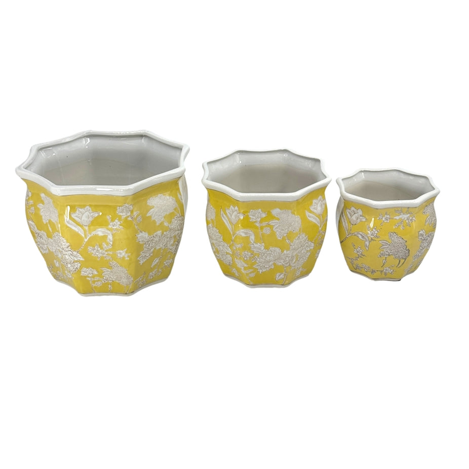 Set of three yellow and white ceramic chinoiserie planter pots with fluted edges and floral patterns