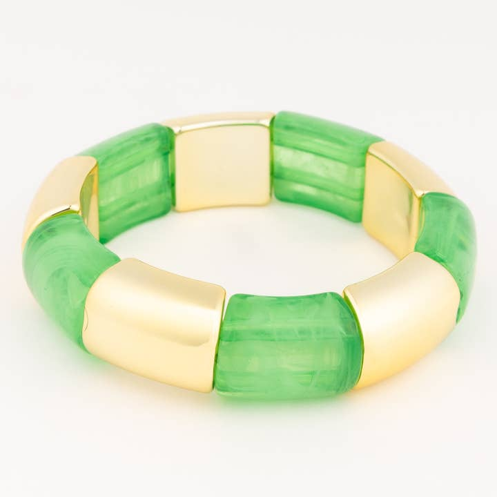 Audrey Pine Bracelet featuring alternating chunky green marbled and polished gold-tone beads.