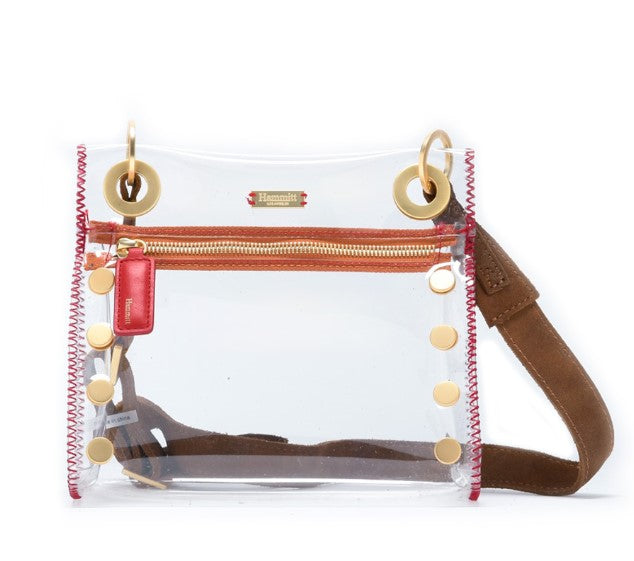 Clear Tony small bag with leather trim, adjustable strap, measuring 8 inches long by 7.5 high.