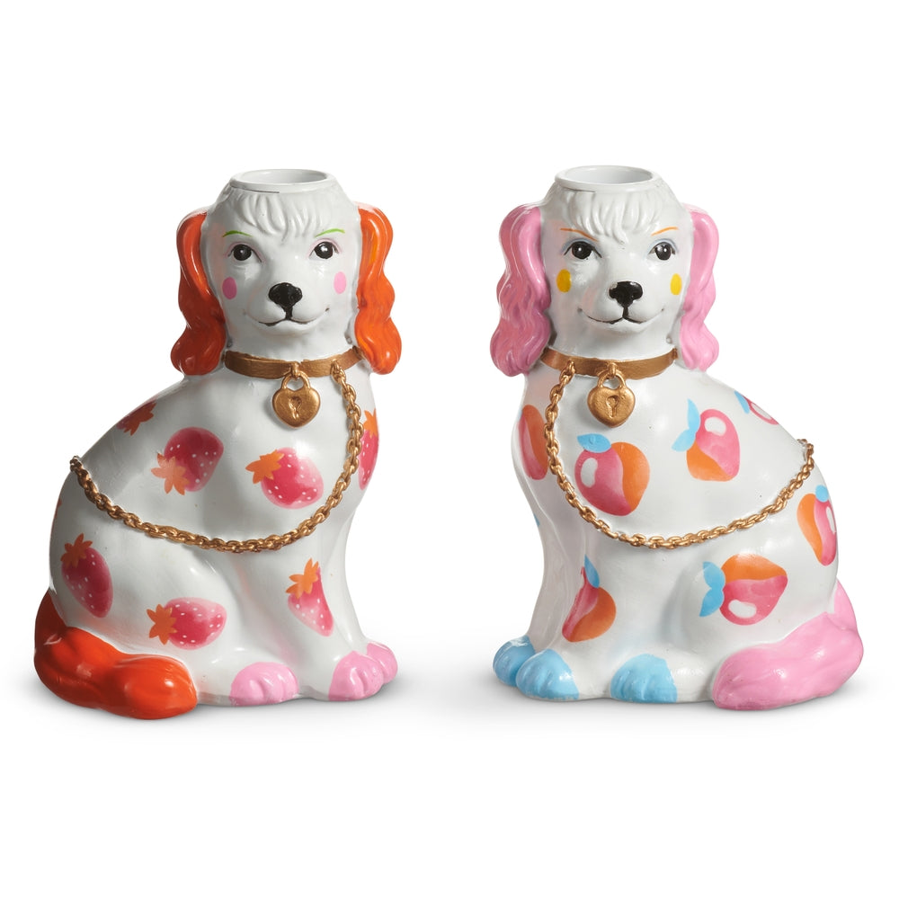 Stone powder dog candle holder with fruit motif measuring 4 by 3 inches.