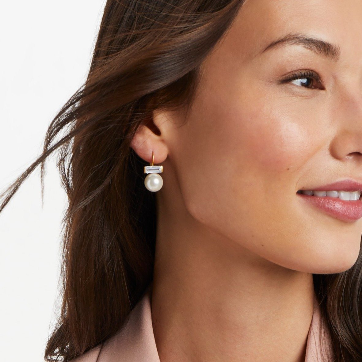 Gold-plated French wire earring with a baguette cubic zirconia stone and a shell pearl drop.