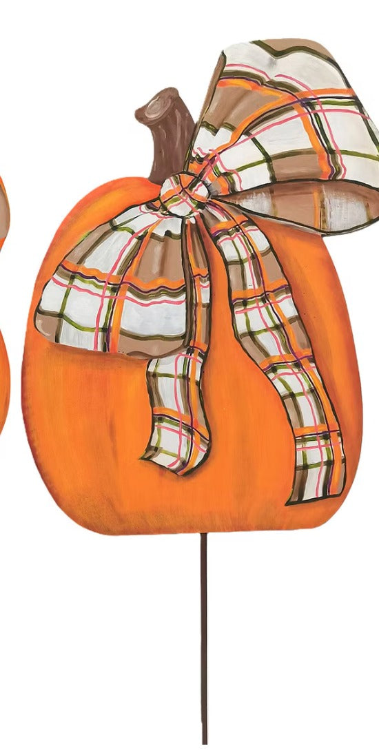 Orange painted wooden pumpkin stake with a colorful plaid bow and brown stem.