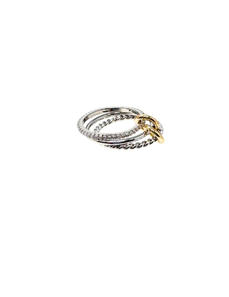 Stacked silver-tone rings with twisted and crystal-encrusted bands, joined by a gold-tone link.