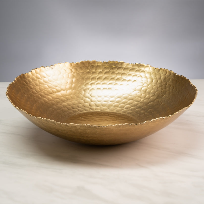 Round gold aluminum bowl with hammered texture and torn edges