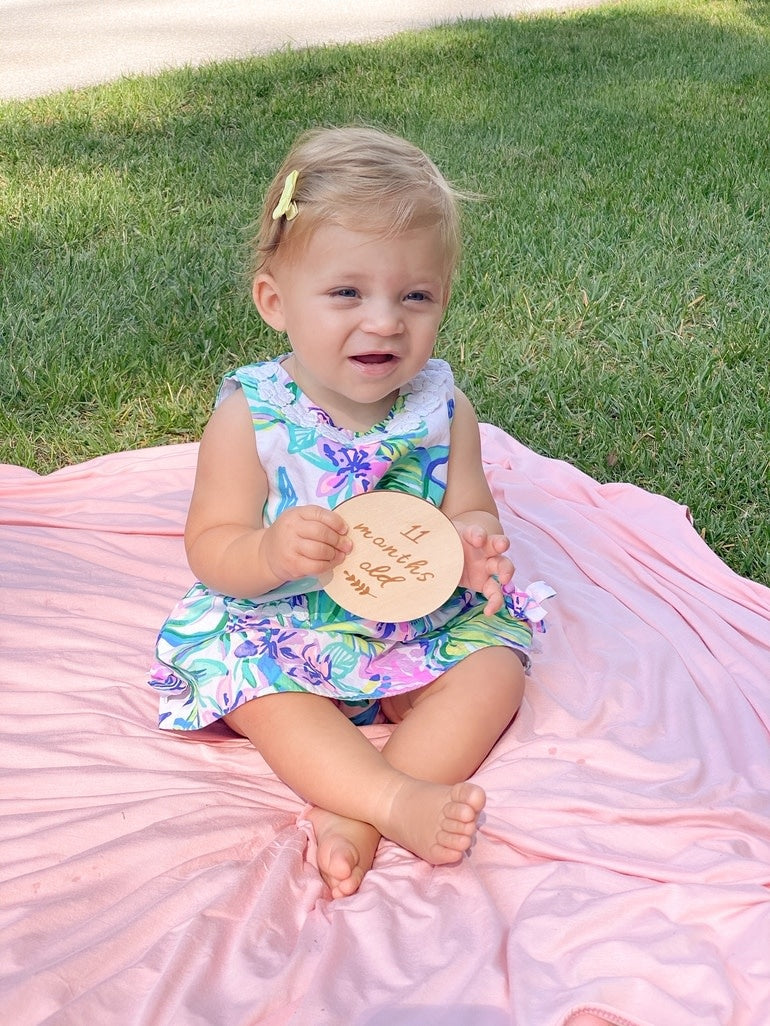 Natural basswood baby milestone cards set with engraved text tracking growth from one week to one year.