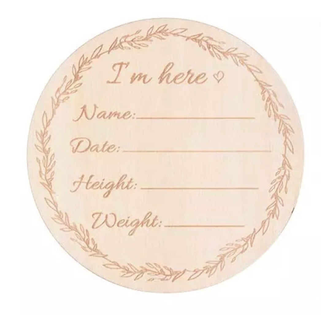 Bohemian baby milestone cards set in natural basswood with engraved text including Hello World and growth measurements.