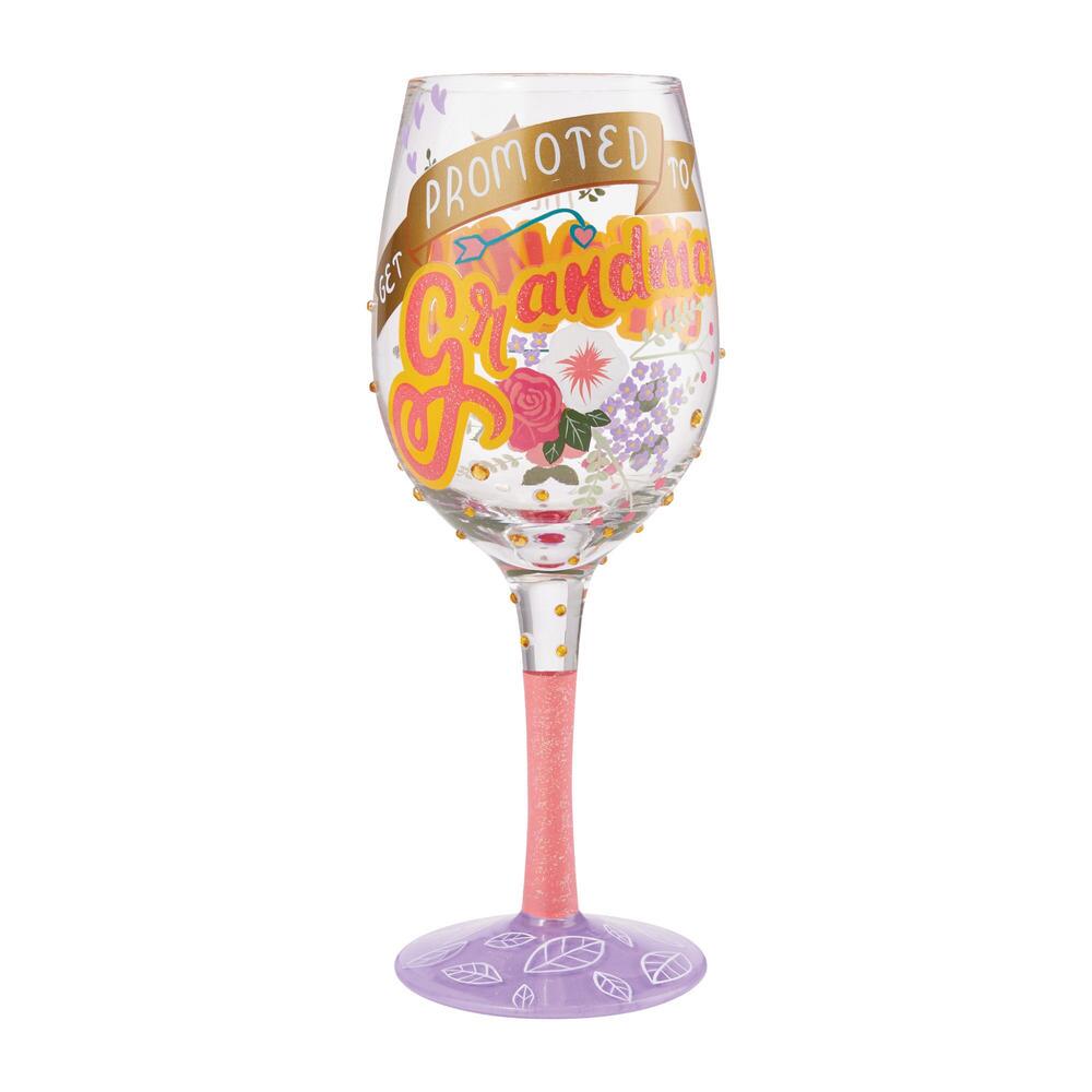 Blown glass wine glass with hand-painted colorful cocktail recipe text on base and glitter accents.