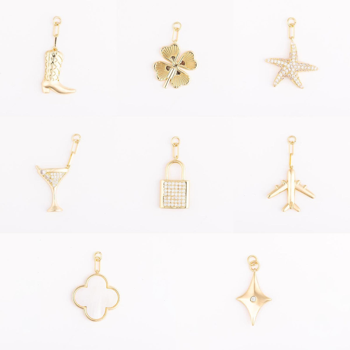 Gold-plated brass bag charm icon with a playful silhouette.