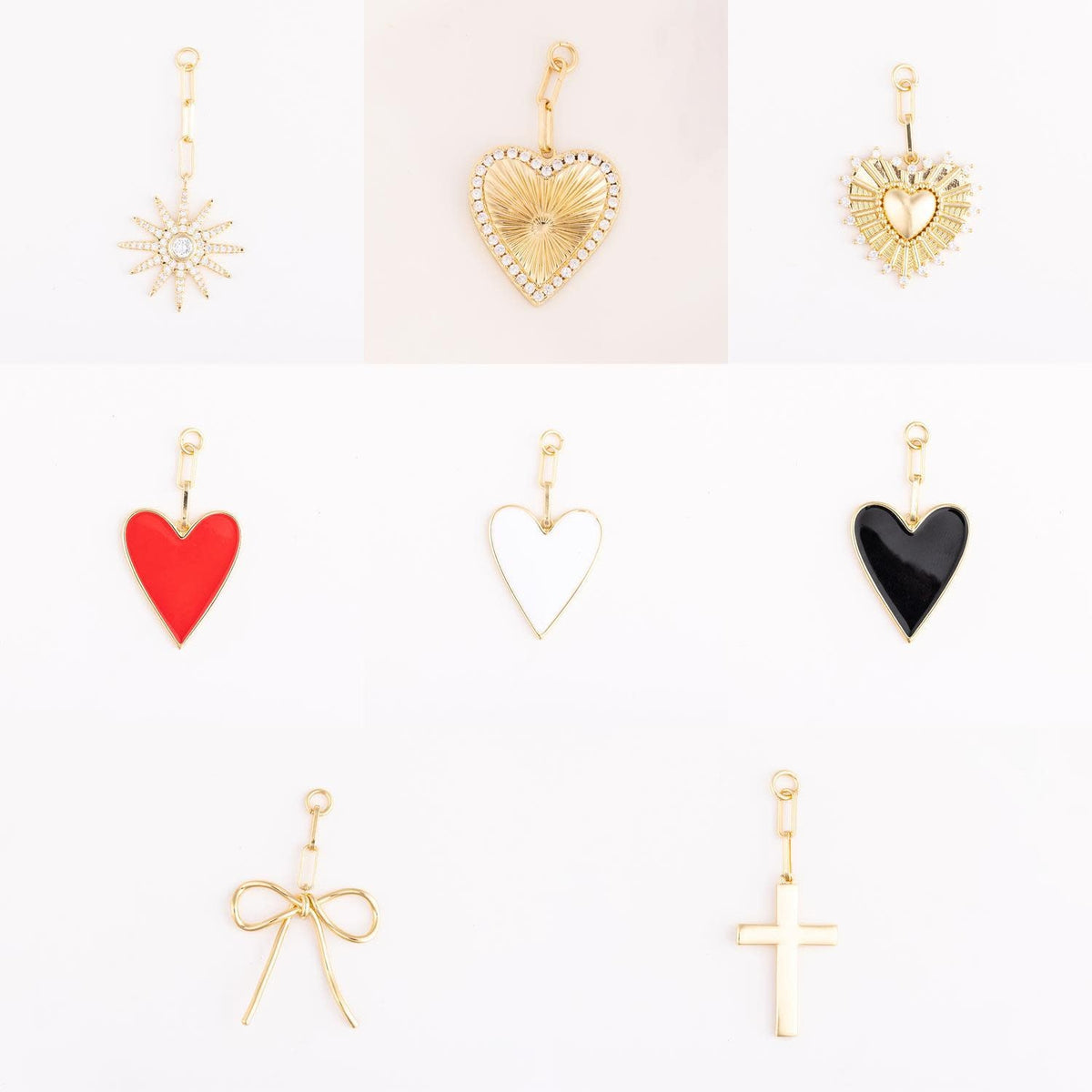 Gold-plated brass bag charm shaped like a small heart with smooth contours.