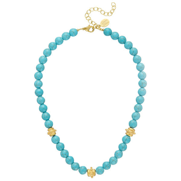 Bailey necklace with hand-strung genuine turquoise beads on a triple-plated gold chain.
