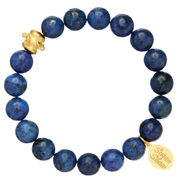 Stretch bracelet with blue lapis lazuli beads and a gold Bentley bead accent.