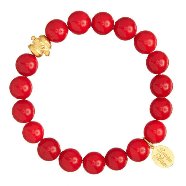 Stretch bracelet with red coral genuine stone beads and a gold Bentley bead accent.