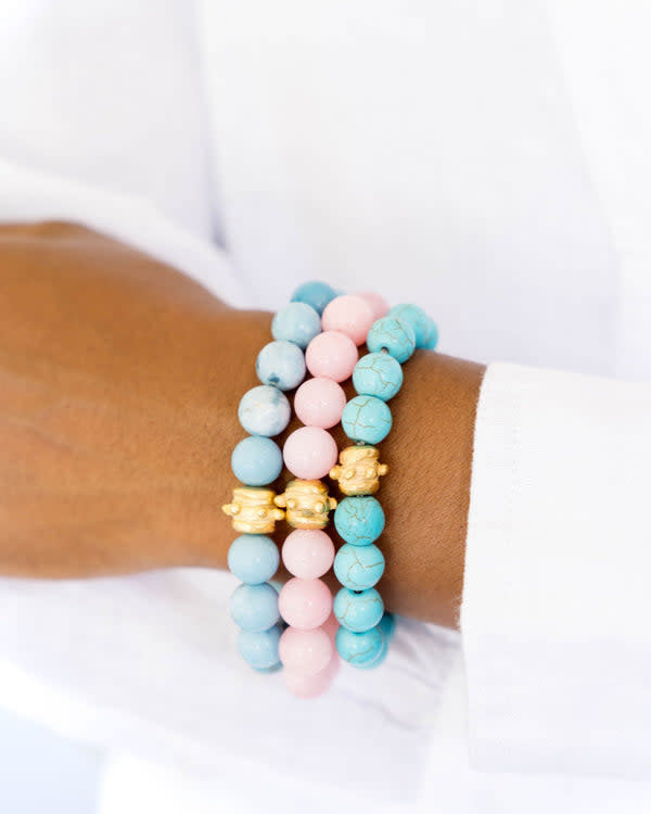Stretch bracelet with hand-strung genuine stone beads in varied hues featuring a gold Bentley bead accent.