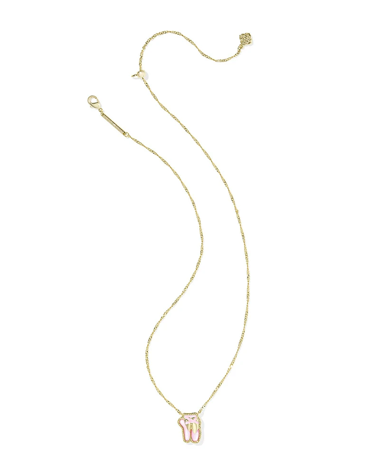 Blush pink mother-of-pearl ballet slipper pendant necklace with gold frame and hoofprint detail on yellow brass chain.