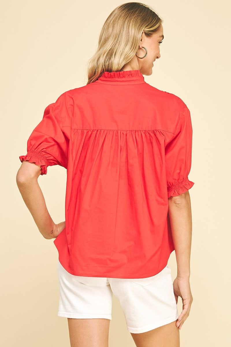Back view of a white cotton balloon sleeve blouse with shirring detail at the back.