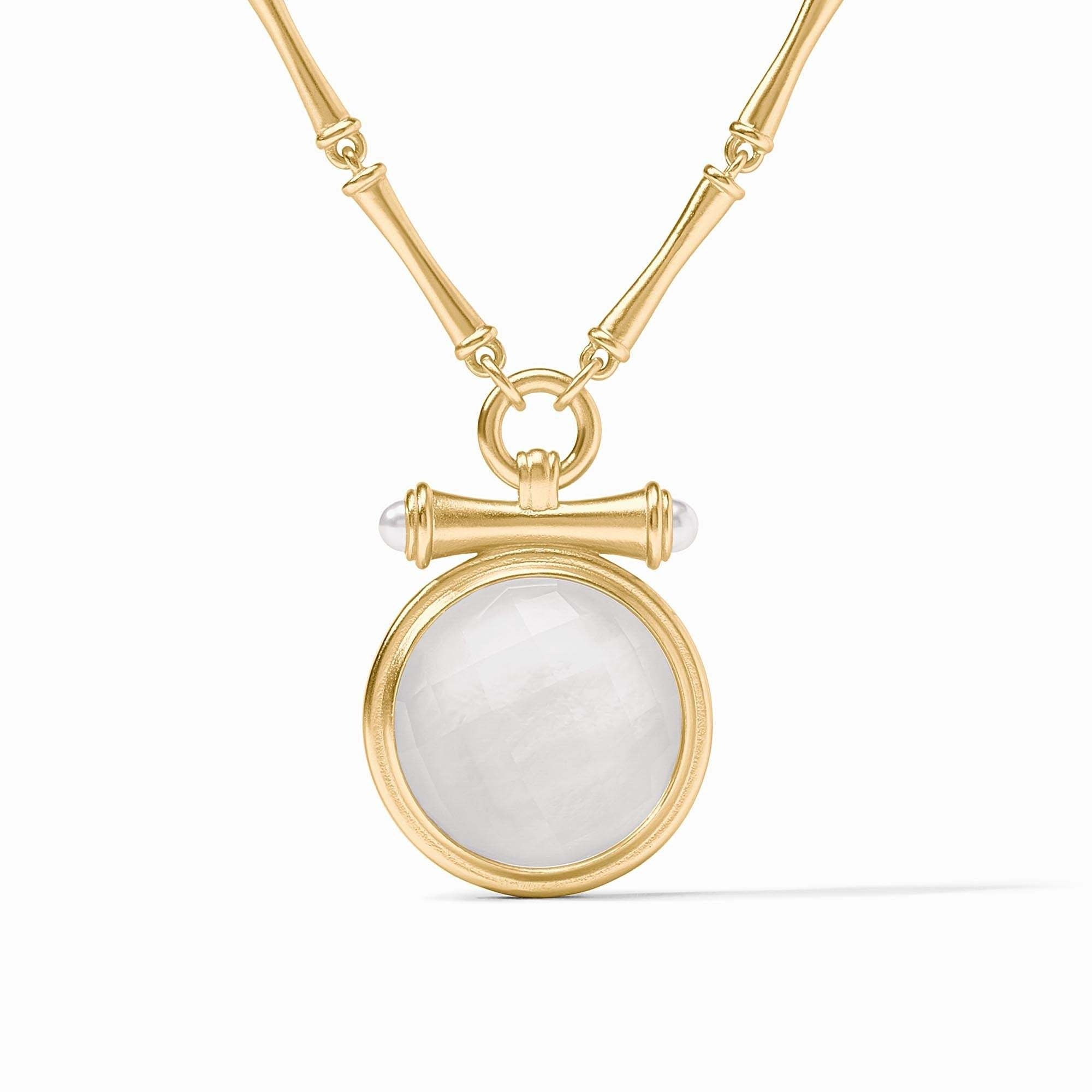 Adjustable bamboo link necklace with golden pendant featuring a pearl cap over an iridescent clear crystal gemstone.