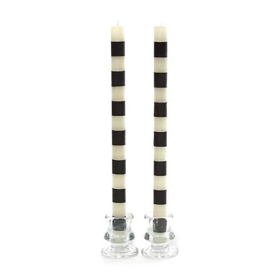 Set of black beeswax paraffin blend dinner candles with a cylindrical silhouette and smooth finish.